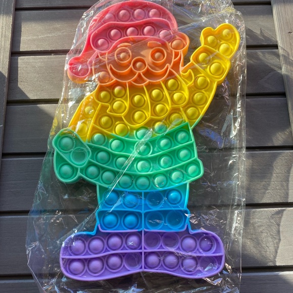 xlarge pastel colored Santa Christmas fidget pop toy 12x7 - Picture 1 of 3